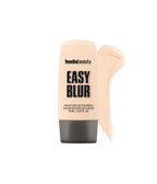 Huda Beauty Mini Easy Blur Natural Airbrush Foundation in 100B Milkshake, tube with a foundation swatch on a gray background