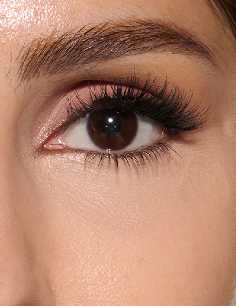 Huda Beauty close-up of the under eye area with concealer blended, step 2 of 3 simple steps