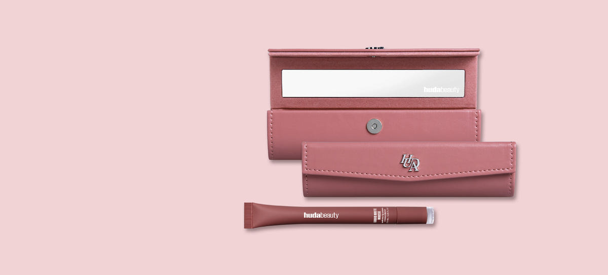 Huda Beauty free lip case gift, showing an open pink lip case with a mirror, the closed case and a Liquid Matte Mousse tube