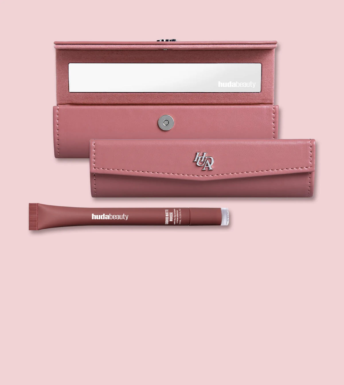 Huda Beauty free lip case gift, showing an open pink lip case with a mirror, the closed case and a Liquid Matte Mousse tube