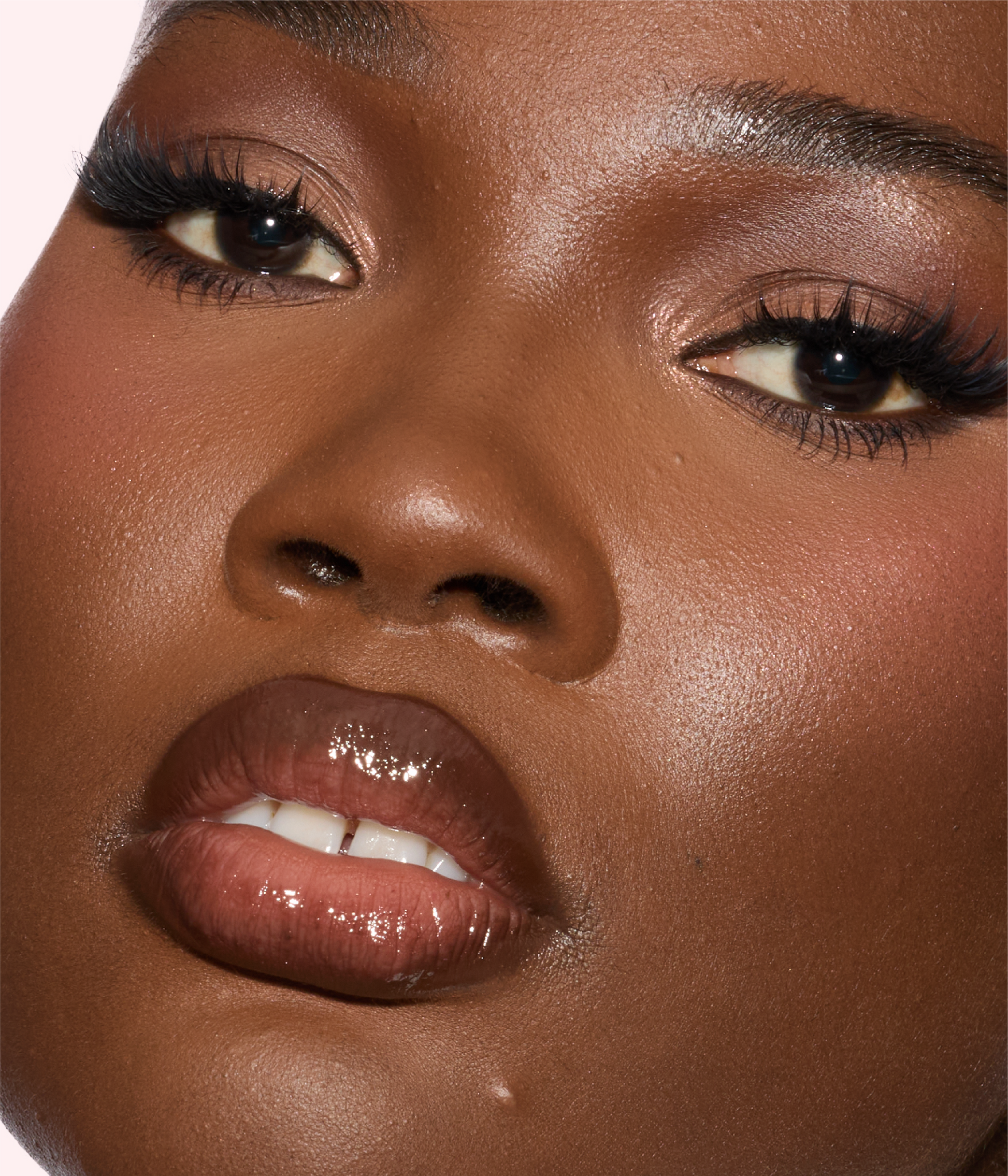 FAUX FILLER Extra Shine Lip Gloss - RichCealer model wearing the product