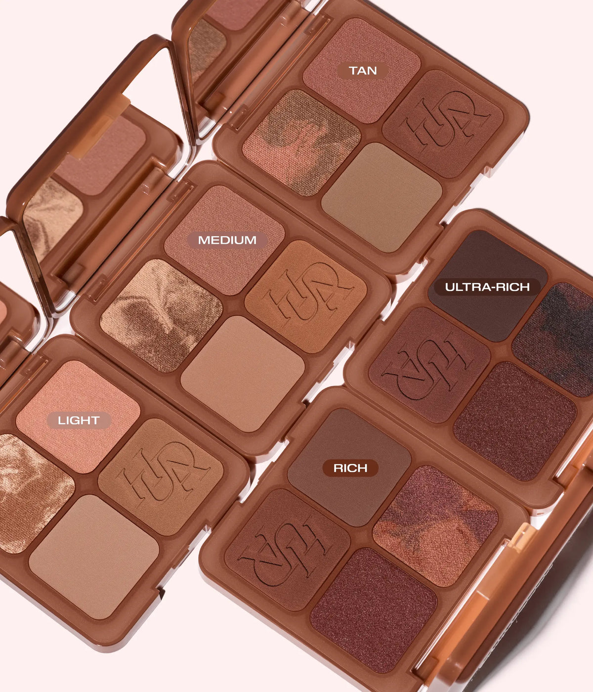 Huda Beauty Bronze Filter Palette full collection, five open palettes labeled 'Light', 'Medium', 'Tan', 'Rich' and 'Ultra-Rich'