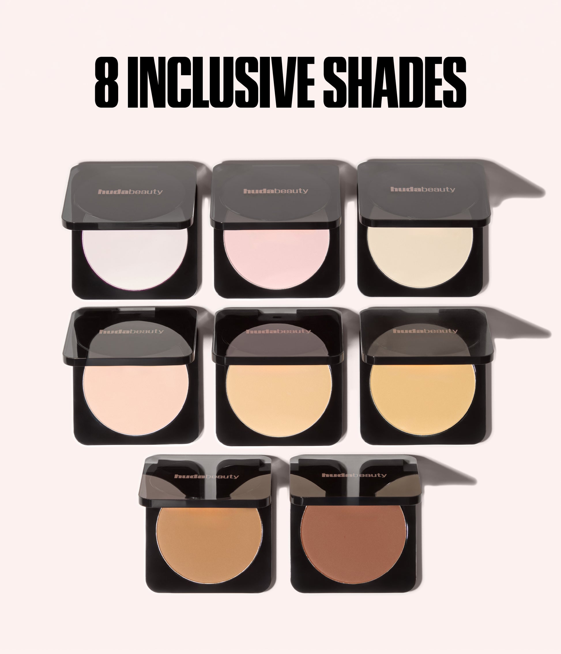 Easy Bake Pressed Powder eight inclusive shades displayed in pressed powder compacts