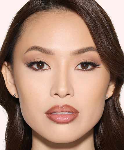 Model with makeup set using Easy Bake Pressed Powder for a smooth finish