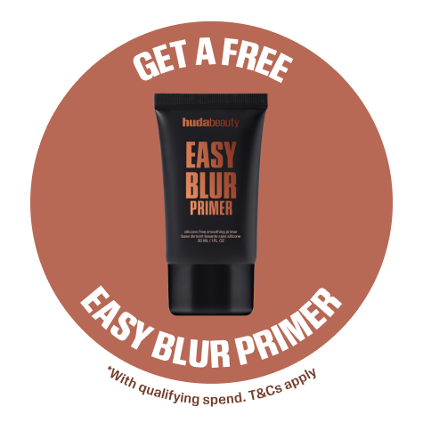 Huda Beauty badge reading 'Get a free Easy Blur Primer' with the primer tube and the text 'With qualifying spend. T&Cs apply.'