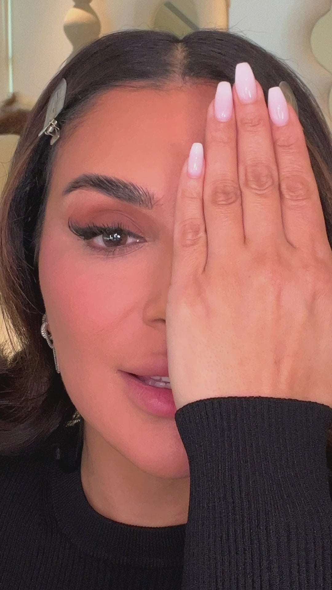 Huda applying Easy Blur Primer and Easy Blur Foundation, demonstrating application steps and discussing the finish on skin.