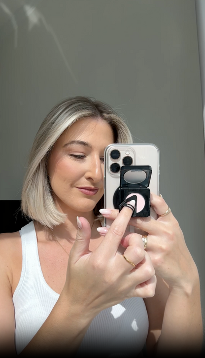 Phone Grip reel video showing Easy Bake Pressed compact attached to the grip, opening and closing the compact and box packaging